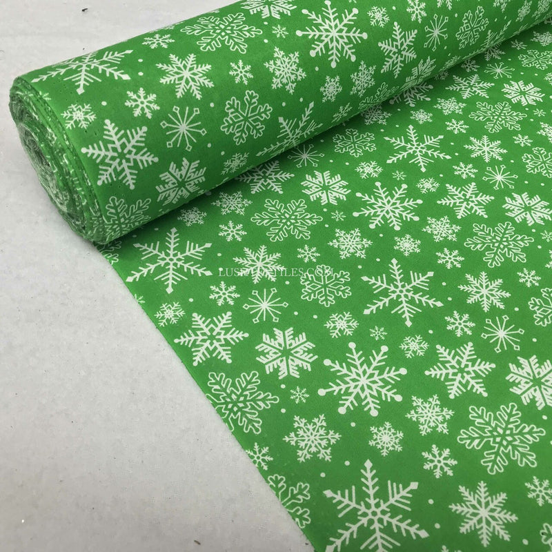 Tissu polycoton de Noël flocons de neige congelés, vert