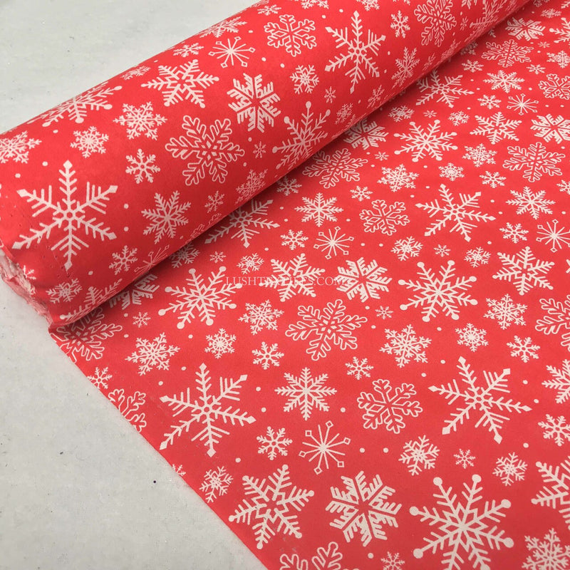 Tissu polycoton de Noël avec des flocons de neige congelés, rouge